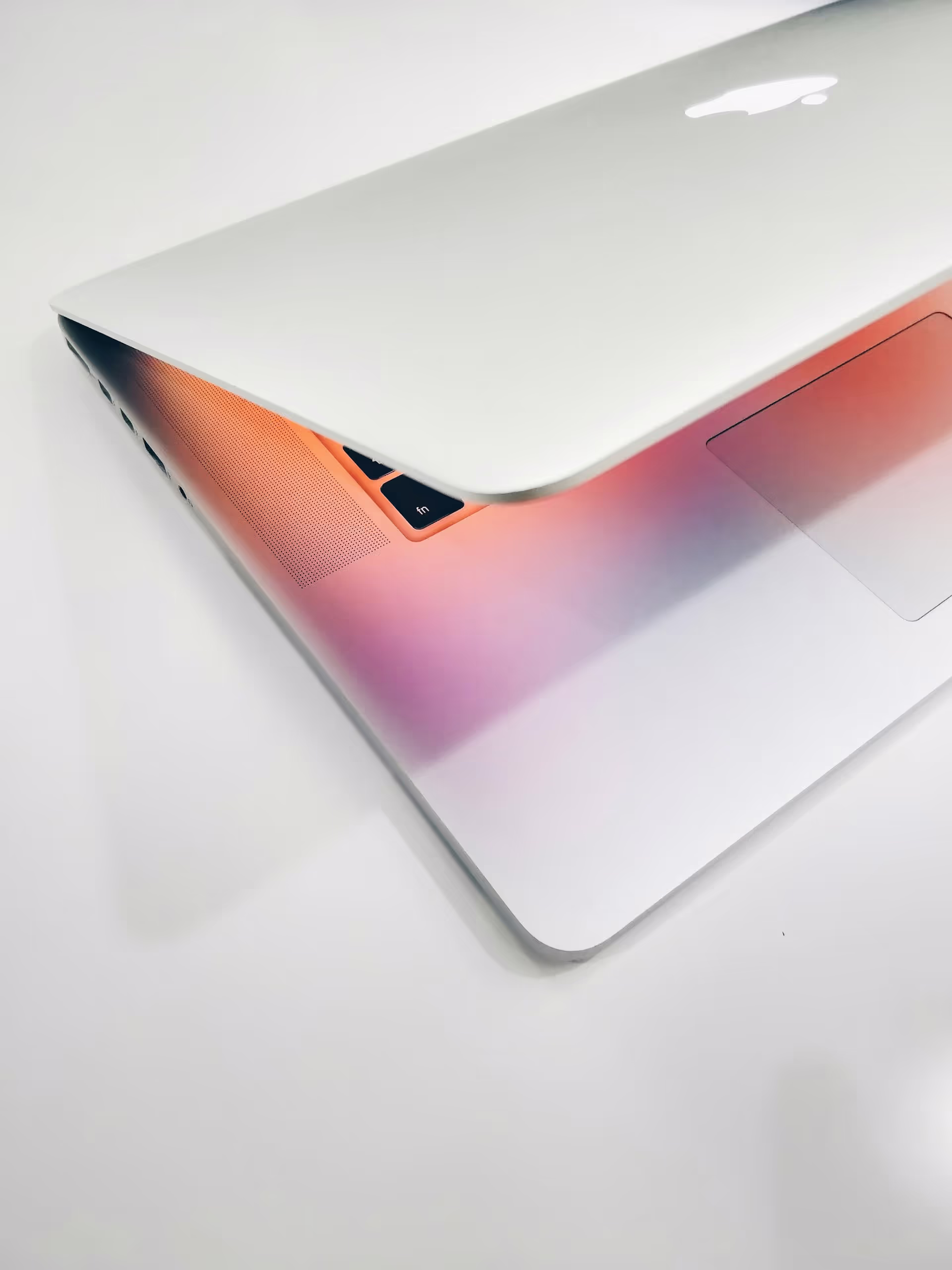A Macbook slightly open.